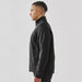 Men's Aleutian Softshell Jacket - A men's softshell jacket in black, featuring a high collar and a side zip pocket. It has a logo on the chest.