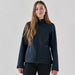 Women's Aleutian Softshell Jacket - A navy softshell jacket for women with a zippered front and two side pockets. It features a branding logo.