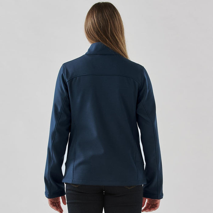 Women's Aleutian Softshell Jacket - A women's softshell jacket in navy blue, featuring a sleek design with a collar and long sleeves.