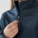 Women's Aleutian Softshell Jacket - A navy women's softshell jacket with a zippered front, featuring a hand adjusting the zipper.