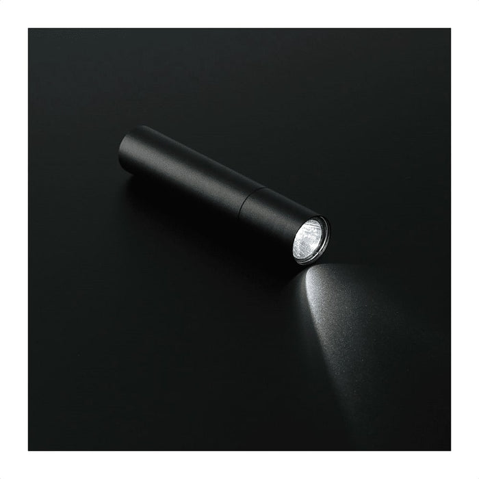 Rechargeable 1200mah Flashlight - A black rechargeable 1200mAh flashlight with a sleek design, emitting a bright beam of light.