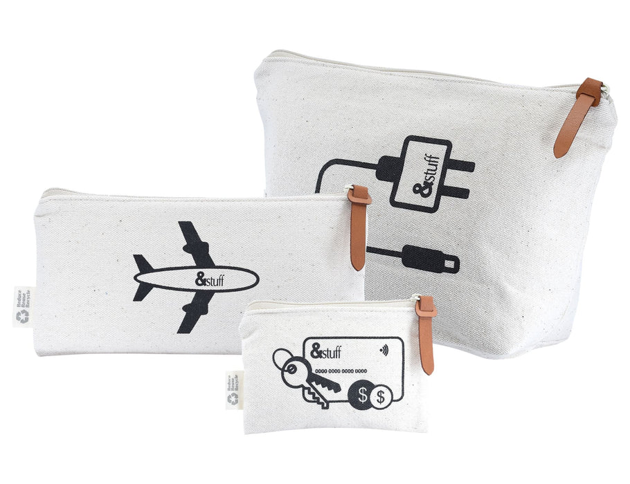 Calico Travel Set - A set of three cream-coloured canvas bags with black designs, featuring an airplane, charger symbol, and key motif.