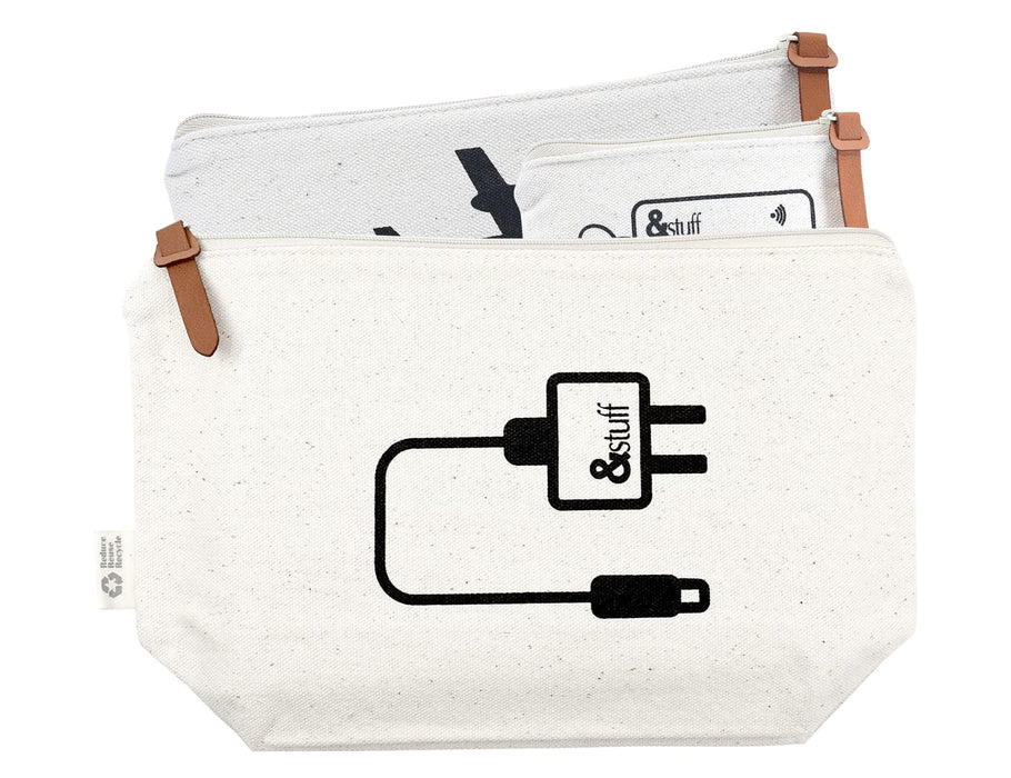 Calico Travel Set - A cream-coloured travel set featuring two pouches with leather accents and minimalist designs, including a logo.