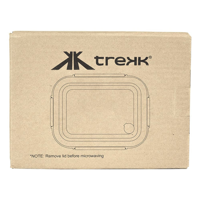Trekk Crib Glass Lunch Box - A cardboard box containing a clear glass lunch box with a rectangular shape and a branding logo.