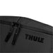 Thule Subterra 2 Toiletry Bag w/ Removable Pouch - A black toiletry bag with a textured surface, featuring a zip closure and a logo.