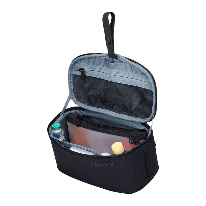 Thule Subterra 2 Toiletry Bag w/ Removable Pouch - A black toiletry bag with a grey interior, featuring multiple compartments and a removable pouch.
