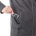 Women's Joris Eco Waterproof Softshell Jacket - A grey softshell jacket with a hand reaching into a zippered pocket, featuring a pull tab.