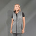 Women's Telluride Lightweight Packable Insulated Puffer Vest - A lightweight, packable insulated puffer vest in grey, featuring a zip front and side pockets, worn over a black shirt.