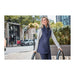 Women's Telluride Lightweight Packable Insulated Puffer Vest - A lightweight, insulated puffer vest in navy, featuring a grey hood, displayed on a woman outdoors.