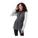 Women's Telluride Lightweight Packable Insulated Puffer Vest - A woman wearing a grey insulated puffer vest over a light grey long-sleeve top, smiling while posing.
