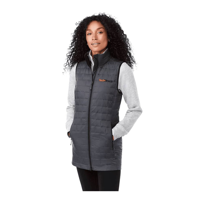 Women's Telluride Lightweight Packable Insulated Puffer Vest - A lightweight packable insulated puffer vest in grey, featuring a high collar and pockets, worn with a grey long-sleeve top.