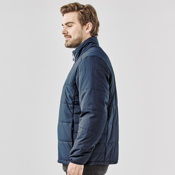Men's Sierra Thermal Jacket - A men's puffer jacket in navy blue, featuring a zip and a stand-up collar. It has a branding logo on the chest.