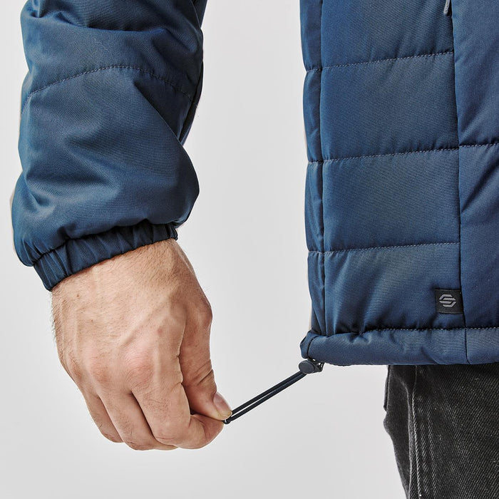 Men's Sierra Thermal Jacket - A navy puffer jacket featuring an adjustable hem and a logo on the side.