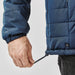Men's Sierra Thermal Jacket - A navy puffer jacket featuring an adjustable hem and a logo on the side.