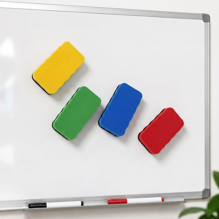 Magnetic Foam Whiteboard Eraser - Four magnetic foam whiteboard erasers in yellow, green, blue, and red are attached to a whiteboard.