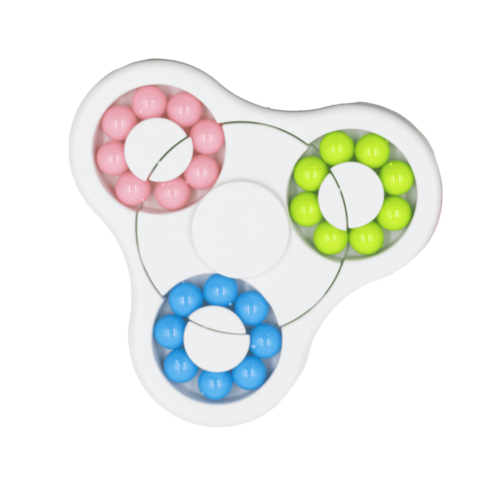 The Spin Buddy Puzzle Game - A colourful puzzle game featuring pink, blue, green, and yellow beads arranged in a circular design with a central section.