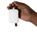 Neo Keychain Powerbank 2000mAh - A hand holds a white rectangular keychain power bank, attached to metal keys.