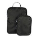 Wander & Roam Compression Packing Cube Set - A set of black compression packing cubes in two sizes with zippers and handles. Features a logo.